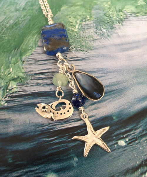 silver fish and sea shell pendant